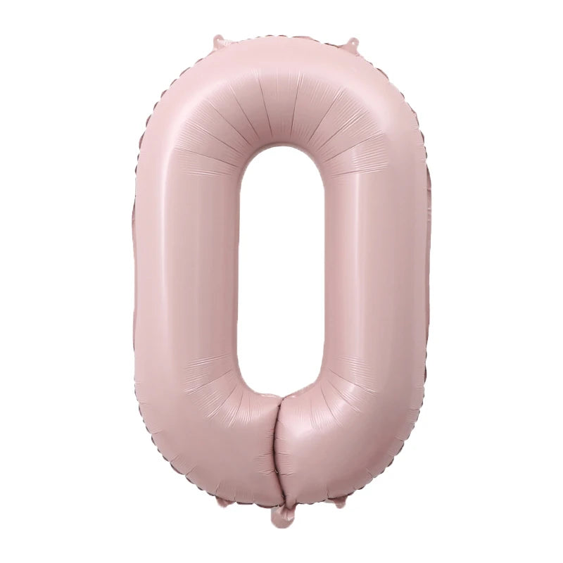 A large, pink foil number balloon shaped like the digit zero.