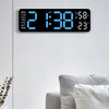 A digital wall clock displaying the time 2:13:38, day of the week, and temperature/humidity information.