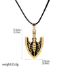 Gold metal arrow keychain featuring a stylized JoJo's Bizarre Adventure motif on a black cord.