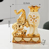 A pair of golden ceramic vases shaped like an elephant and a swan for modern home decor