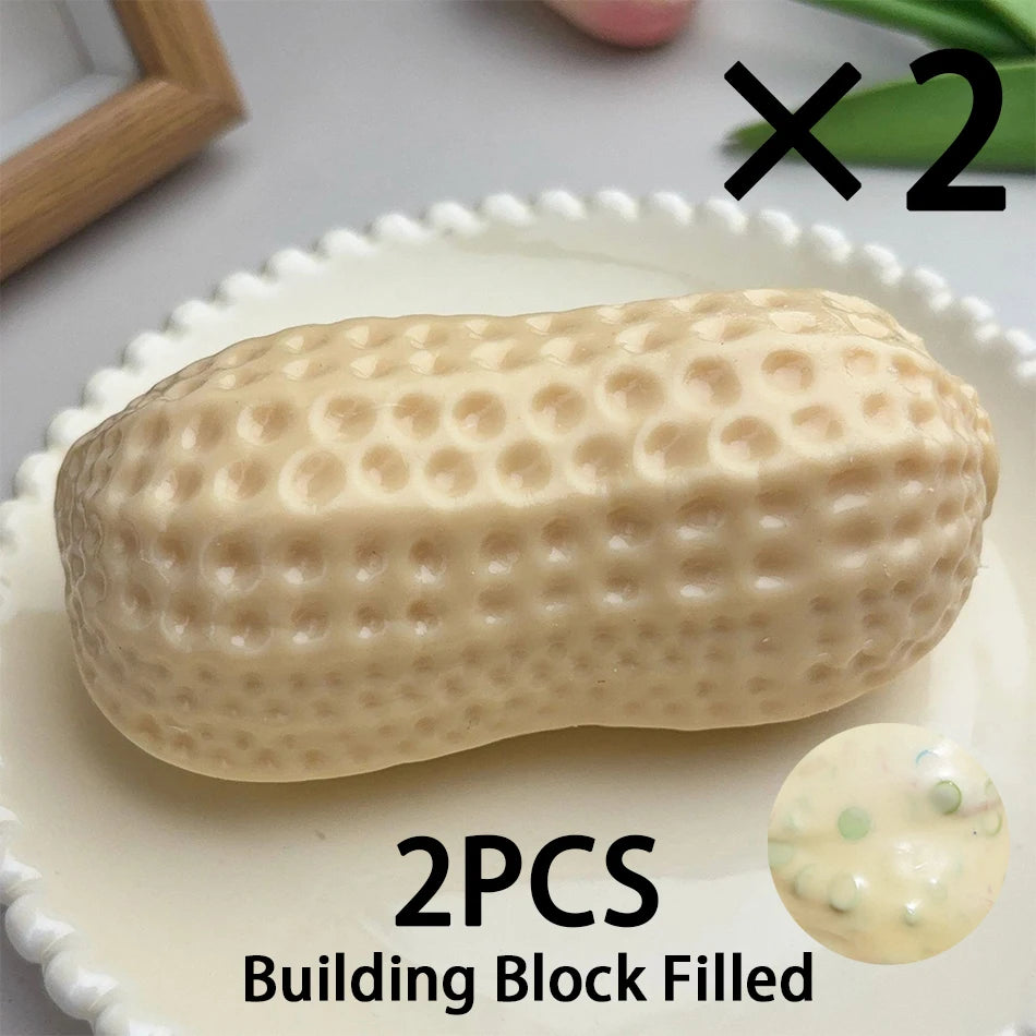 Two peanut-shaped building blocks filled with a light beige material.