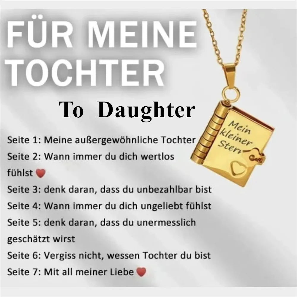 A gold pendant necklace featuring an openable book design with engraved German text for a daughter