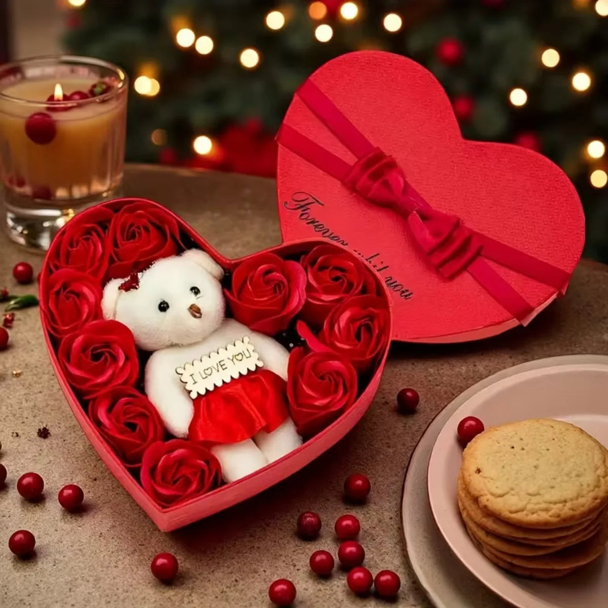 A red heart-shaped gift box filled with artificial roses and a white plush bear
