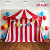 A red and white striped circus party backdrop banner featuring a draped fabric with colorful balloons.