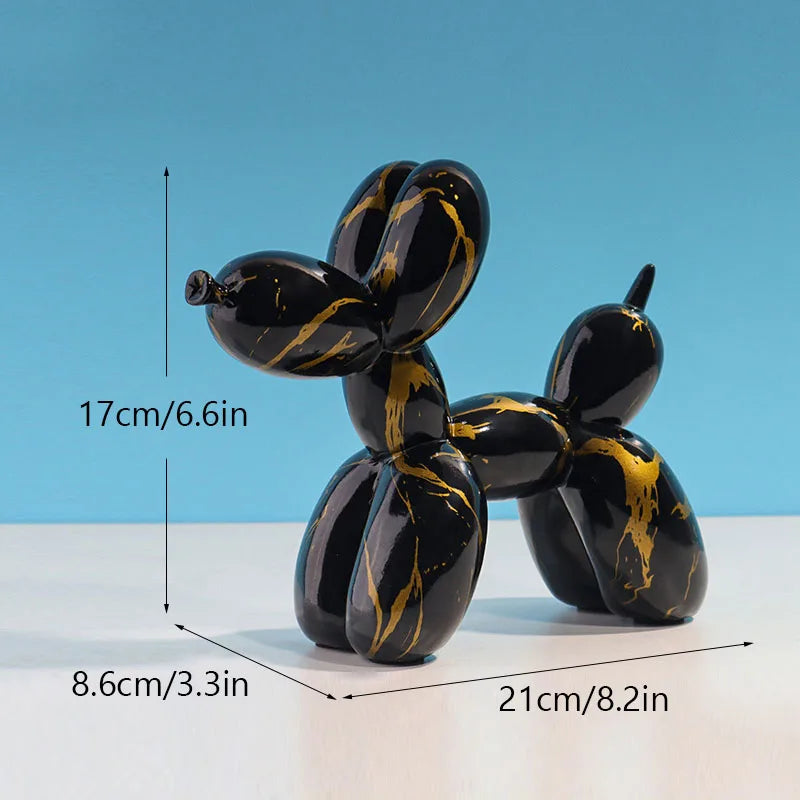 Black and gold resin balloon dog sculpture with dimensions 17cm long and 8.6cm high.