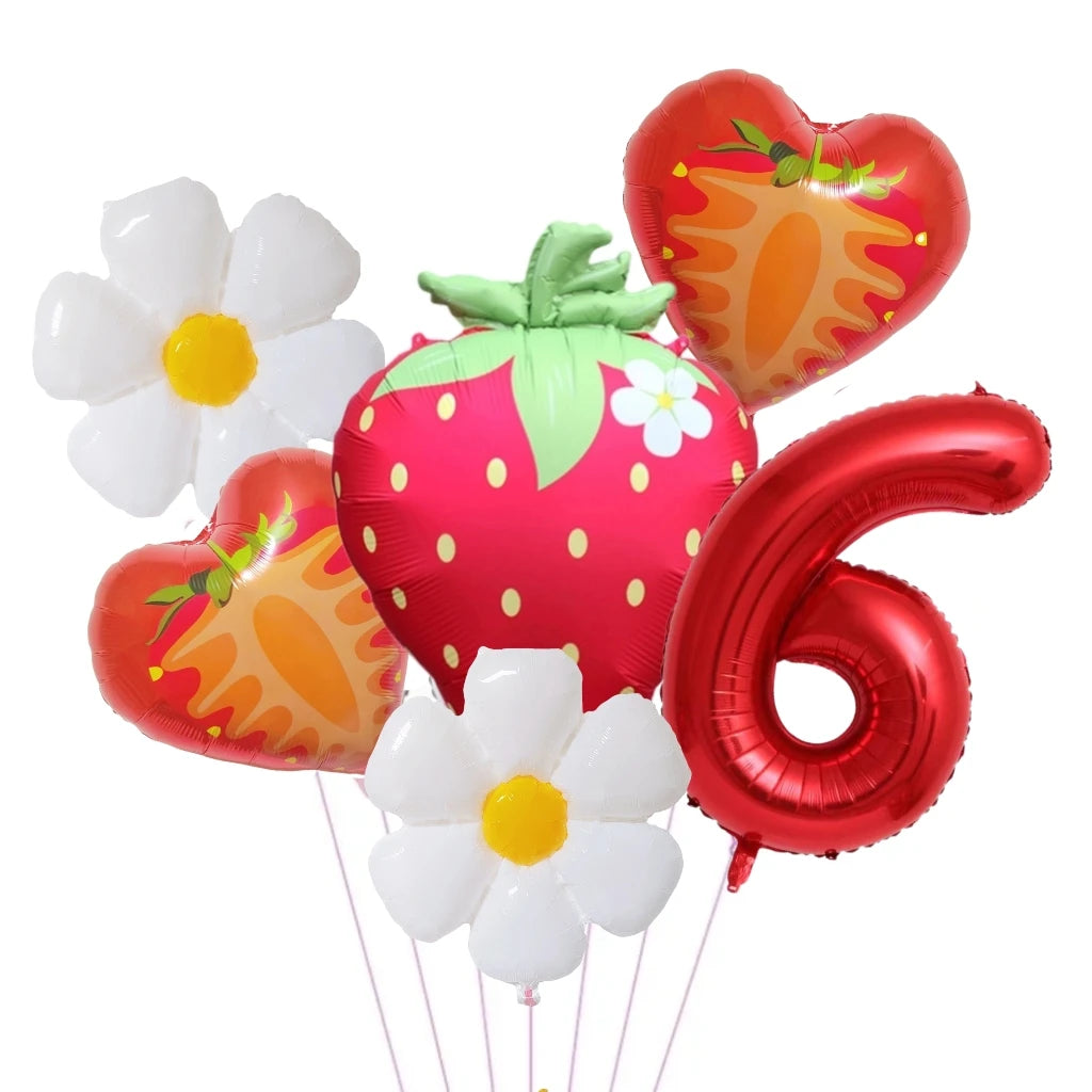 A bouquet of six heart-shaped foil balloons in shades of pink, orange, and white, including a large number six balloon.