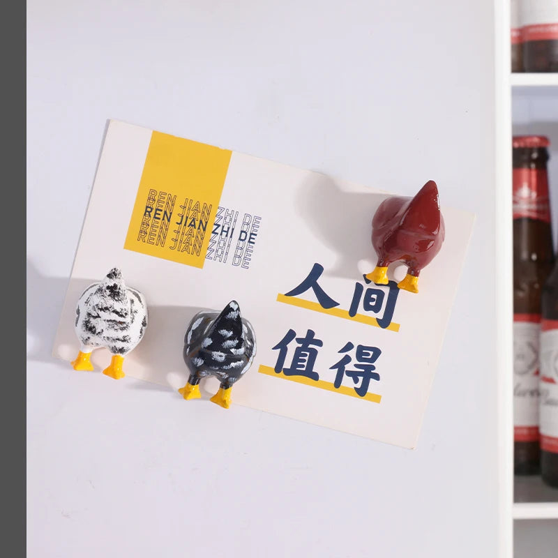 A set of three playful chicken butt fridge magnets featuring different colored chickens and Chinese text.
