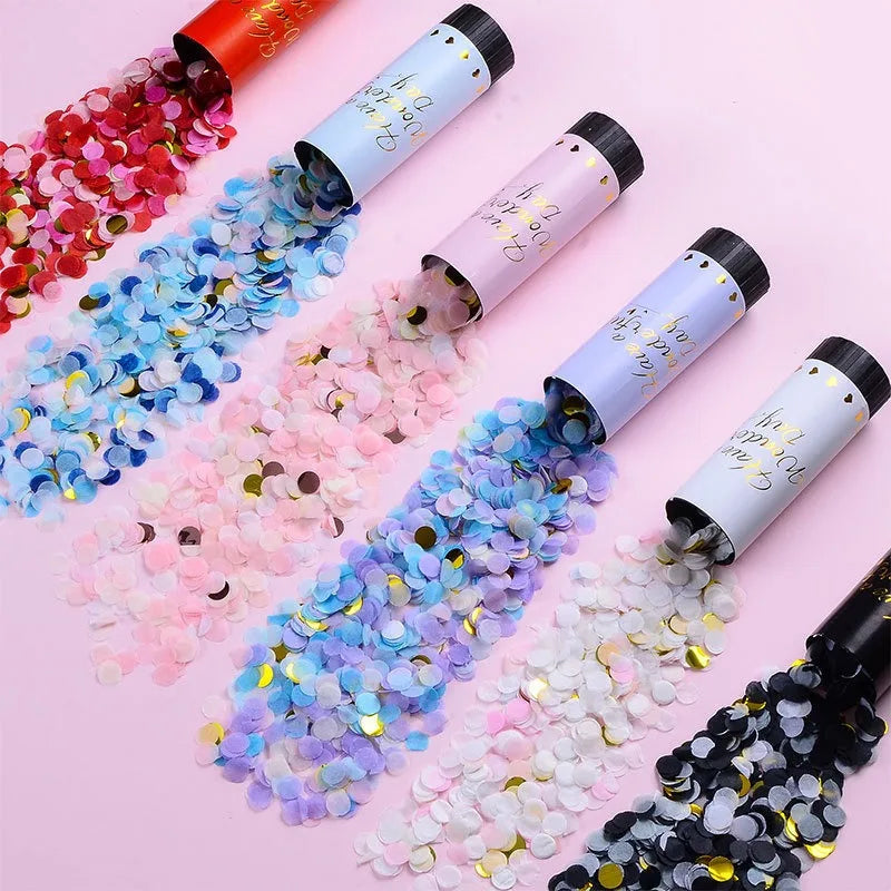 Hand twist confetti cannons in various colors including pink, blue, purple, and black