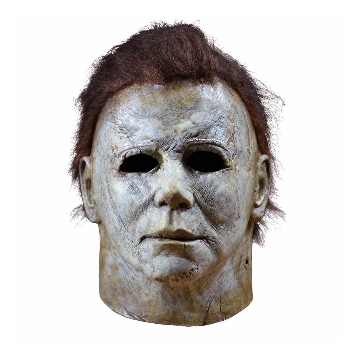 A weathered, pale latex mask resembling Michael Myers with a bloody scar detail.