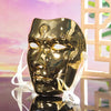 A golden, ancient style masquerade mask with Hanfu-inspired design is displayed on a reflective surface.