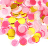 A pile of round tissue paper confetti dots in shades of pink and gold.