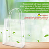 Clear reusable PVC gift bags with handles shown on a wooden surface.