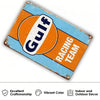 Vintage metal tin sign with orange and blue paint featuring the text GUIT surf racing team