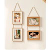 A set of three rustic wooden collage photo frames with natural twine hanging on a light background.