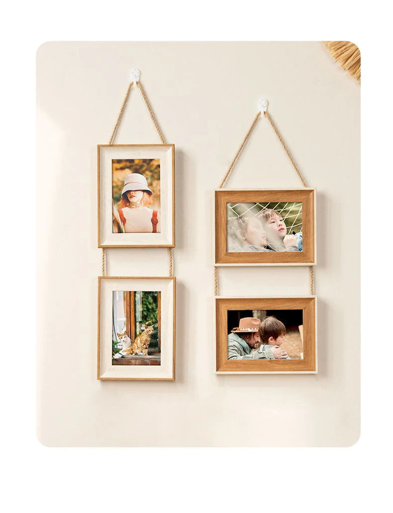 A set of three rustic wooden collage photo frames with natural twine hanging on a light background.