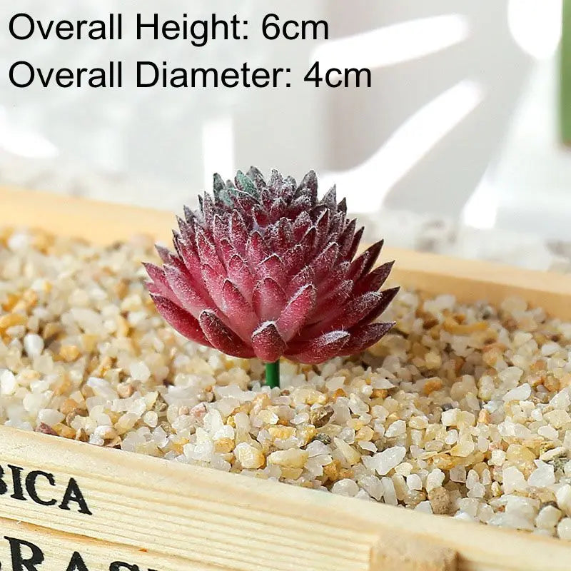 A small, deep pink succulent bonsai ball is planted in coarse gravel within a wooden tray.