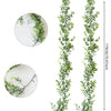 Two vertical strands of artificial eucalyptus greenery used for floral decoration