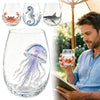 A collection of stemless wine glasses featuring handcrafted blue-ringed octopus and other ocean-themed decorations.