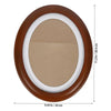 An elegant oval wooden wall photo frame with a brown finish and white border.