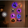 A display of Halloween themed 3D wall stickers featuring a castle, spider, bats, and a jack-o'-lantern, illuminated by purple