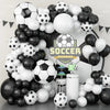 A balloon garland arch kit featuring black and white balloons for soccer-themed birthday party decorations.
