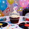 A cupcake decorated with a musical note topper and a sparkly number 9 candle surrounded by colorful balloons.