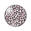 Round glass cabochon with a leopard print pattern in black and pink.