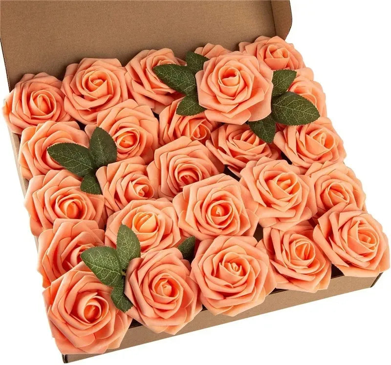 A box filled with lifelike foam roses in shades of peach and coral for wedding and home décor.