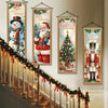 Vintage Christmas porch hanging banners featuring Santa, snowman, and reindeer designs displayed on a staircase.