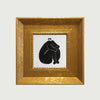 An elegant gold photo frame with a black silhouette of a person sitting.