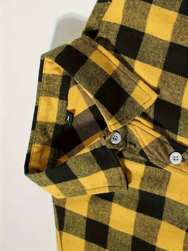 A close-up of a men's yellow and black plaid flannel shirt with button details.