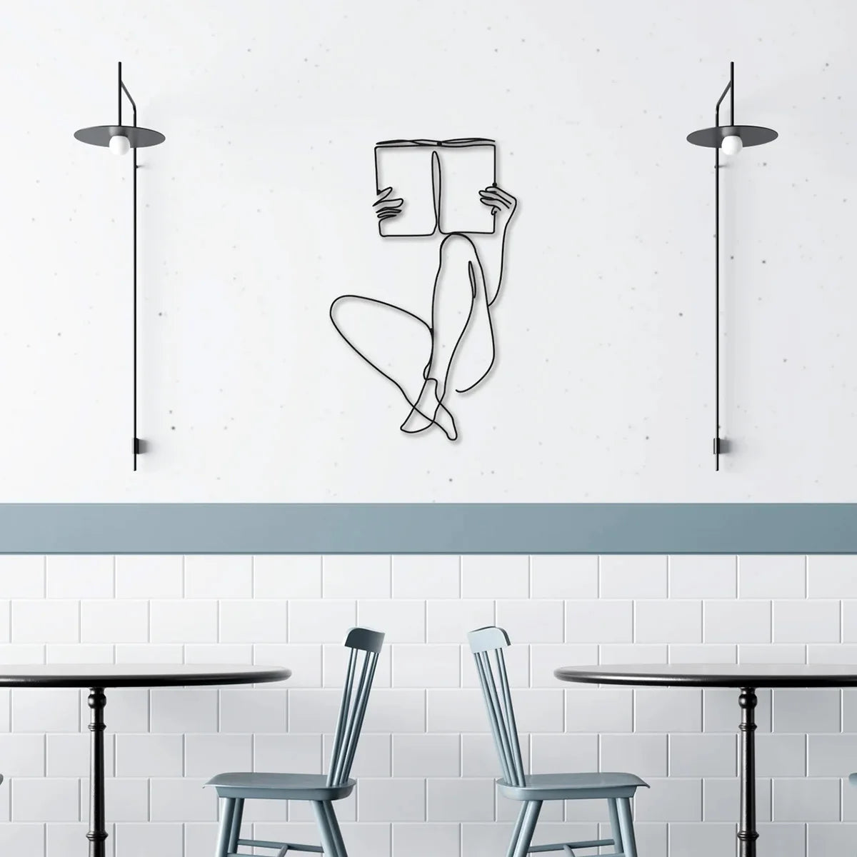 Elegant metal line art wall decor featuring a stylized figure and modern pendant lights above a kitchen or dining area.