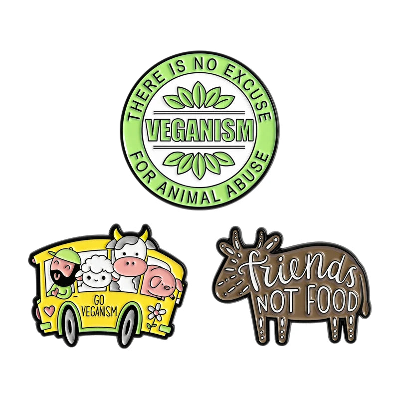 A set of enamel pins featuring cartoon designs including a rude middle finger and a daisy flower.