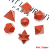 A set of red jasper platonic geometry crystals including cubes, pyramids, and spheres.