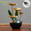 A golden tabletop fountain featuring green leaves and clear water, designed to be waterproof ip8.