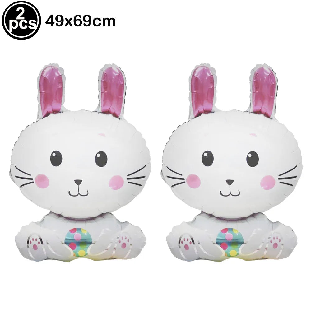 Two white cartoon bunny foil balloons with pink ears and colorful feet