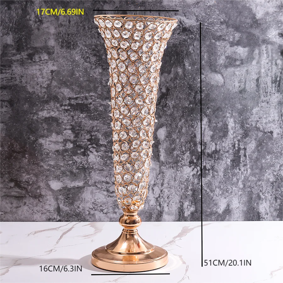 A tall, ornate crystal gold flower vase with a flared rim and pedestal base.