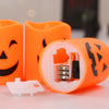 A set of six orange battery-powered LED Halloween candles with flickering flames displayed on a white surface.