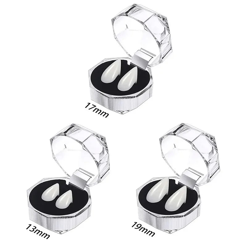 A pair of realistic vampire fangs with an adjustable fit shown in a silver packaging box.