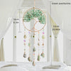 A hanging crystal tree of life sun catcher with green aventurine leaves and dangling crystals.