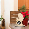 A wooden ultrasound photo frame with a silhouette of a mother and baby, set on a wooden surface.