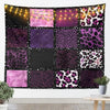 A tapestry wall hanging featuring a collage of leopard print patterns in shades of purple, pink, and black.