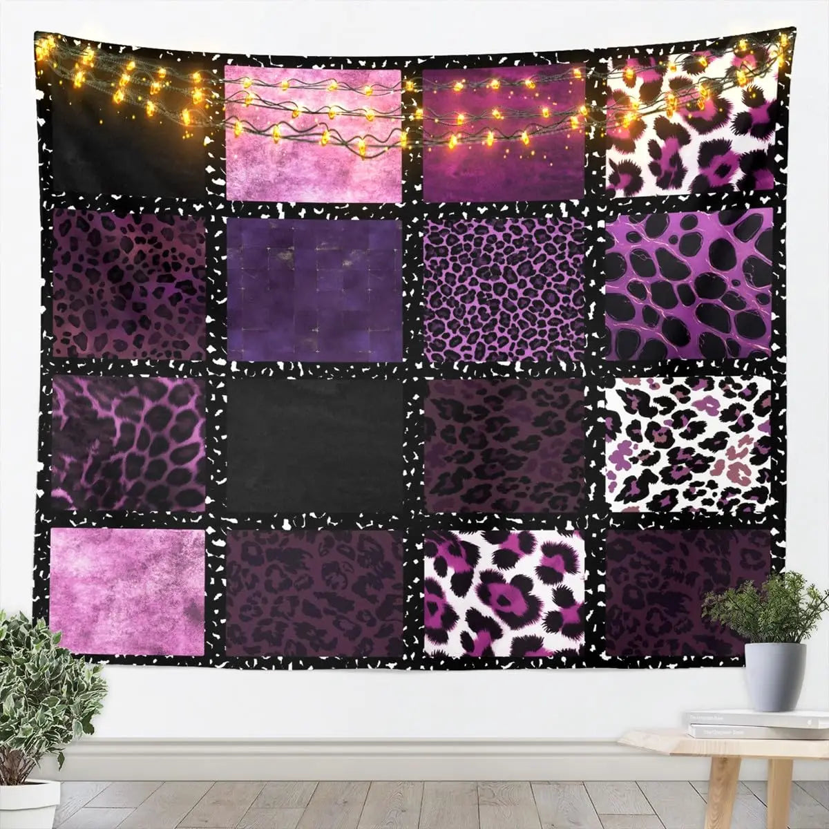 A tapestry wall hanging featuring a collage of leopard print patterns in shades of purple, pink, and black.