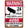 Vintage metal sign warning about 24-hour video surveillance in Spanish and English.