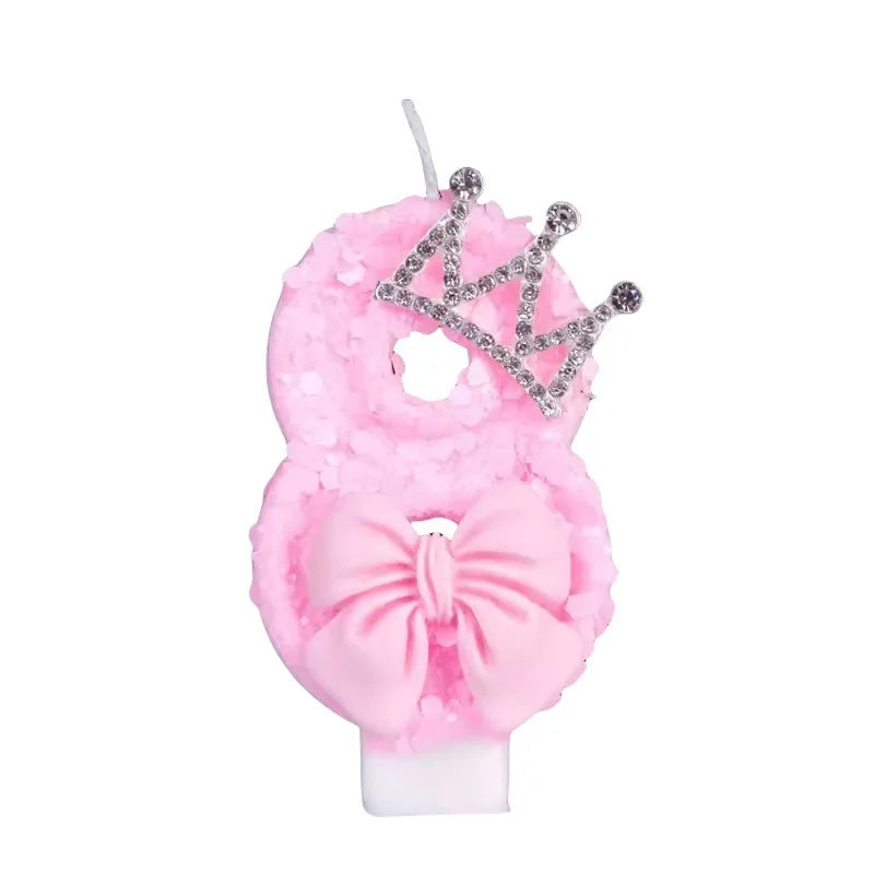 Pink princess birthday candles with a crown and bow for cake toppers