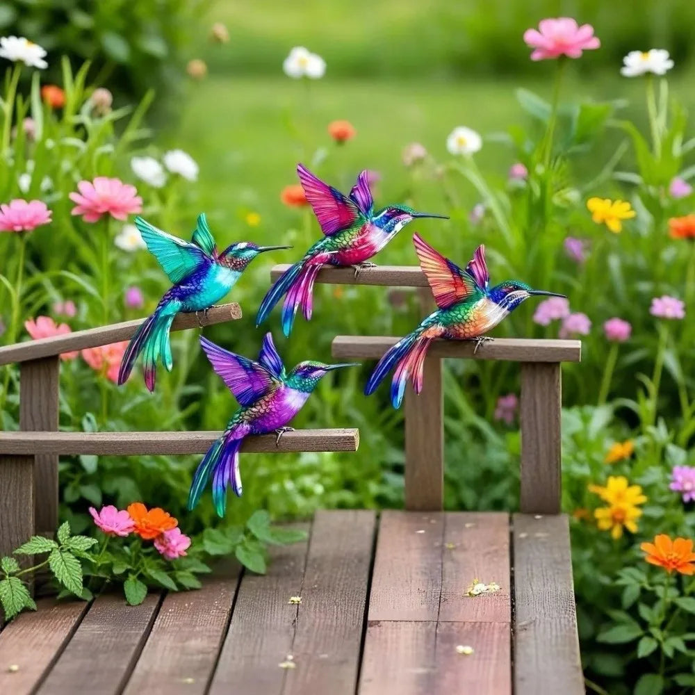 Vintage metal hummingbird wall art featuring iridescent blue and green birds in a garden setting.