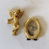A set of gold-colored wall decor featuring a winged cherub angel statue and an ornate gold oval frame.
