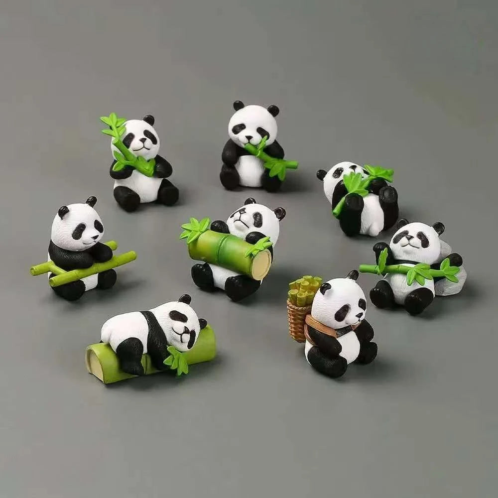 A set of mini resin panda bonsai figurines, some holding green leaves.