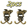 Two antique brass metal wall hooks for kitchen or bathroom use