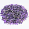 A pile of purple and grey tumbled gemstone chips for crafts and jewelry making